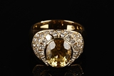 AN 18K GOLD DIAMOND AND NATURAL SRI LANKA YELLOW SAPPHIRE RING
