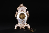 AN ANTIQUE FRENCH PORCELAIN MANTEL CLOCK