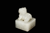 A CARVED WHITE JADE 'LION' SEAL 