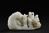 A FINELY CARVED HETIAN WHITE JADE 'FIGURES' BOULDER, SHANZI