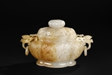 A CARVED WHITE JADE ‘SUNFLOWERS' CENSER WITH LID