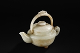 A CARVED WHITE JADE TEAPOT