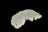A WHITE JADE CARVED 'DRAGON' PENDANT
