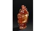 A RED AGATE VASE WITH COVER 