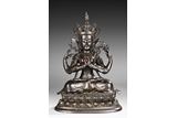 A BRONZE MODEL OF SEATED AVALOKITESVARA