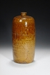 A BROWN GLAZED SLEEVE BOTTLE