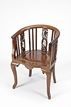 A HARDWOOD HORSESHOE ARMCHAIR