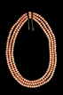 A VINTAGE THREE-STRAND CORAL NECKLACE