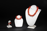 A SET OF PINK CORAL NECKLACE, BRACELET, AND EARRING