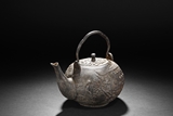 AN IRON 'GARDEN' TEAPOT