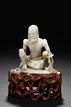 A SOAPSTONE CARVED FIGURE OF ASCETIC SHAKYAMUNI
