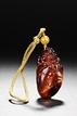 A CARVED AMBER 