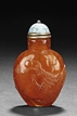 A CARVED AMBER 