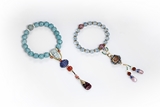 A SET OF TWO TURQUOISE AND TOURMALINE BRACELETS