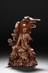 A CARVED BAMBOO GUANYIN FIGURE