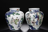 A PAIR OF WUCAI 'FIGURES' JARS