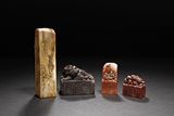 A GROUP OF FOUR CARVED STONE SEALS