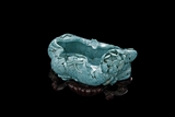 A TURQUOISE CARVED 