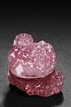 A PINK TOURMALINE CARVED 'BUDDHIST LIONS' BOX