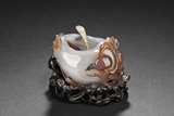AN AGATE 'MONKEY STEALING PEACHES' WATERPOT
