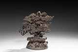 A BRONZE CAST PINE TREE GROUP