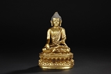 A GILT-BRONZE FIGURE OF BHAISAJYAGURU