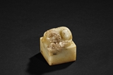 A YELLOW AND RUSSET 'LION' JADE SEAL