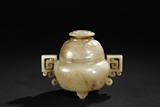 A WHITE JADE CARVED TRIPOD CENSER WITH COVER