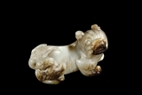 A WHITE AND RUSSET JADE 'DOG'