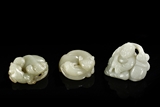 A GROUP OF THREE CELADON JADE CARVINGS