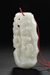 A WHITE JADE CARVED PENDANT