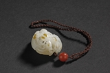 A CARVED WHITE JADE 