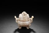 A CARVED JADE TRIPOD CENSER