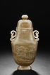 A CARVED JADE BOTTLE VASE