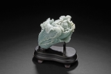 A WELL CARVED JADEITE CABBAGE WITH INSECTS