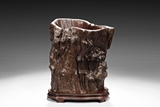 A NATURALISTIC TRUNK CARVED SCROLL POT