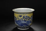 A YELLOW GROUND BLUE AND WHITE JAR