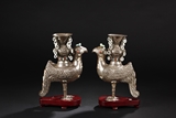 A PAIR OF SILVER PHOENIX ZUN VASES INSET WITH GEMS