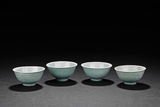 A SET OF FOUR TURQUOISE-GROUND TEA CUPS