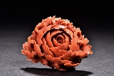 A CORAL CARVED PEONY BROOCH