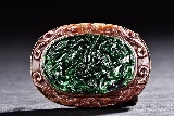 A SPINACH JADE CARVED BROOCH