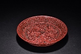 A CINNABAR LACQUER 'PEONY' DISH