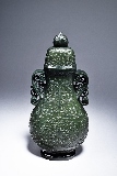 A MUGHAL STYLE SPINACH JADE VASE WITH COVER