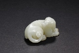 A WHIET JADE RECUMBENT DOG