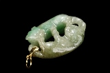 A JADEITE 'BUDDHIST LIONS' PENDANT