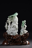 A CARVED JADEITE GUANYIN FIGURE