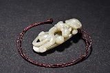 A WHITE JADE CHILONG PENDANT