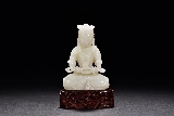 A WHITE JADE CARVED BODHISATTVA