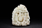 A WHITE JADE CARVED BOULDER