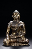 AN IRON PARCEL GILT BUDDHA